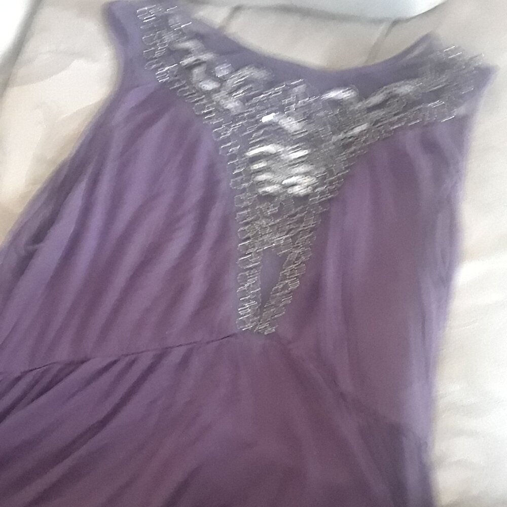 Purple beaded peplum sleeveless shirt